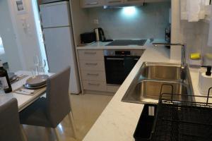 Kuchyň nebo kuchyňský kout v ubytování Stela apartament