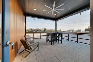 a patio with chairs and a table and a ceiling fan at Jolene on Main - East Nash - 1 Mile to DTNash - NEW in Nashville