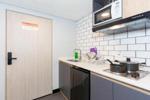 a kitchen with a sink and a counter top at Terrazas in Bogotá