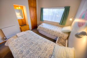 מיטה או מיטות בחדר ב-Tripinn Hostel Backpackers YHA