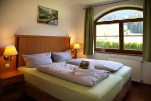Postel nebo postele na pokoji v ubytování Die Filzmooserin - Apartments in Filzmoos