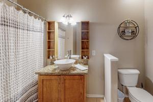 a bathroom with a sink and a toilet at Star Beachside Condominiums 106 in South Padre Island +7 photos