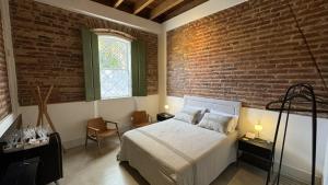 Postel nebo postele na pokoji v ubytování Vila Casarão - Casa de Hóspedes
