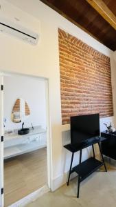 TV a/nebo společenská místnost v ubytování Vila Casarão - Casa de Hóspedes