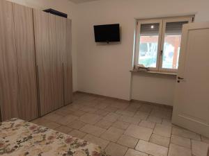 TV a/nebo společenská místnost v ubytování Casa vacanza Il Rifugio