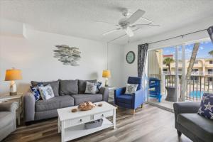 a living room with a couch and a table at Spanish Trace 243 in St. Augustine +26 photos