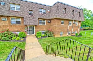 a brick house with a staircase in the yard at Pine Brook 416 I Corporate 15Br Apartment ! Pool in Newark