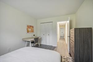 a white bedroom with a desk and a bed at Pine Brook 816 I Corporate 2Br Apartment ! in Newark +16 photos