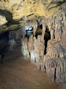 a cave with stalactites and formations in it at Villa La Falaise in Oualidia