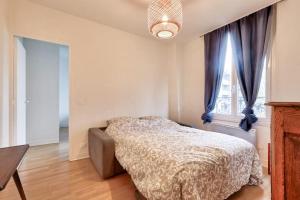 Postel nebo postele na pokoji v ubytování Appartement fonctionnel et équipé Bagneux