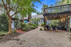 a house with a deck and a patio at Bare Feet Bungalow -Close to beach & dog friendly in Gulfport