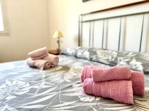 Posteľ alebo postele v izbe v ubytovaní Villa Fiorella Porto Cesareo primo piano 2 locali