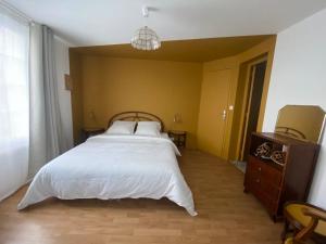 Postel nebo postele na pokoji v ubytování La Part Entière