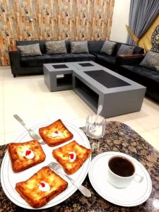 a table with plates of food on a table at Western Lodge Guest House Islamabad in Islamabad