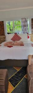 Uma cama ou camas num quarto em Goodlife guest house in klerksdorp
