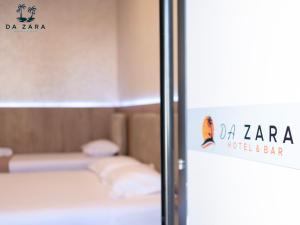 Postel nebo postele na pokoji v ubytování Da Zara Hotel