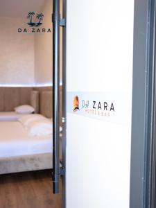 Postel nebo postele na pokoji v ubytování Da Zara Hotel
