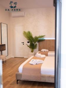 Postel nebo postele na pokoji v ubytování Da Zara Hotel