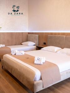 Postel nebo postele na pokoji v ubytování Da Zara Hotel