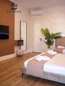 Postel nebo postele na pokoji v ubytování Da Zara Hotel