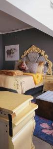 a bedroom with two beds and a mirror on the wall at Goodlife guest house in klerksdorp in Klerksdorp