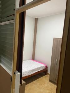a small bedroom with a bed in a room at salome apart in Tarapoto