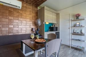 a dining room with a table with a bowl of food on it at Rooftop Home With Whirlpool & Sauna - Happy Rentals in Trebnje +15 photos