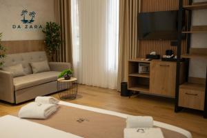 Postel nebo postele na pokoji v ubytování Da Zara Hotel