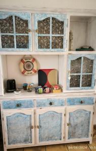 a blue and white cabinet with four glass doors at Casa Frasca in Teguise