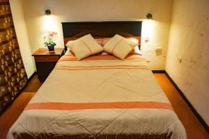 Postel nebo postele na pokoji v ubytování Hostal Cielo + 11 fotografií