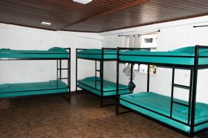 Un pat suprapus sau paturi suprapuse la El Machico Hostel
