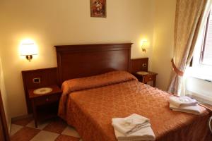 Postel nebo postele na pokoji v ubytování Elegance