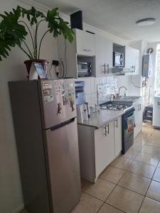 Kuchyň nebo kuchyňský kout v ubytování Apartamento