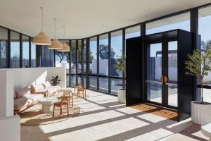a rendering of a living room with glass walls at The Clairfield Hotel in Mudgee