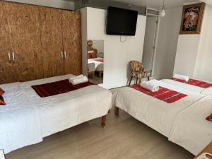 Rúm í herbergi á Hotel Plateros