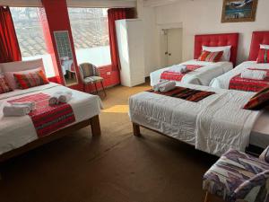 Rúm í herbergi á Hotel Plateros