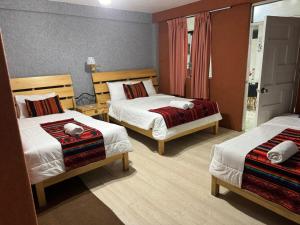 Rúm í herbergi á Hotel Plateros