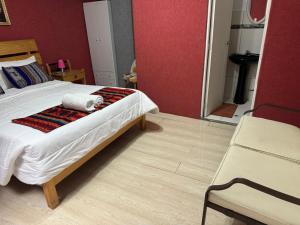 Rúm í herbergi á Hotel Plateros