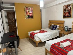 Rúm í herbergi á Hotel Plateros