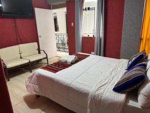 Rúm í herbergi á Hotel Plateros