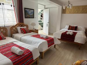Rúm í herbergi á Hotel Plateros
