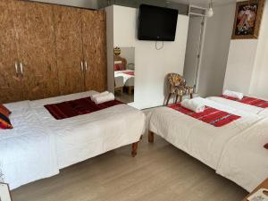 Rúm í herbergi á Hotel Plateros