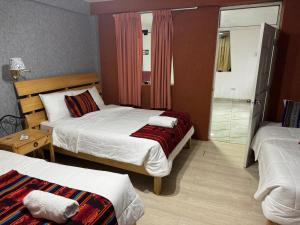 Rúm í herbergi á Hotel Plateros