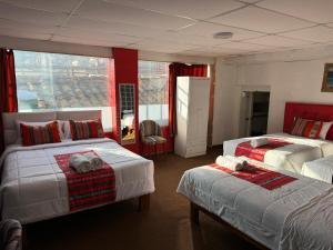 Rúm í herbergi á Hotel Plateros