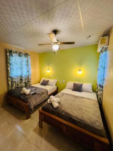 Postel nebo postele na pokoji v ubytování Hotel VILLAS DON PABLO LAS TABLAS