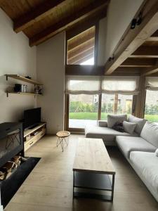 a living room with a couch and a coffee table at Chalet en la Cerdanya in Latour-de-Carol