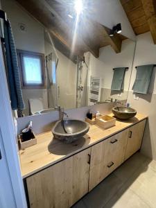 a bathroom with two sinks and a large mirror at Chalet en la Cerdanya in Latour-de-Carol +36 photos