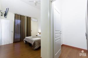 Postel nebo postele na pokoji v ubytování Opera B&B