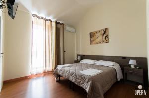 Postel nebo postele na pokoji v ubytování Opera B&B