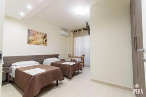 Postel nebo postele na pokoji v ubytování Opera B&B
